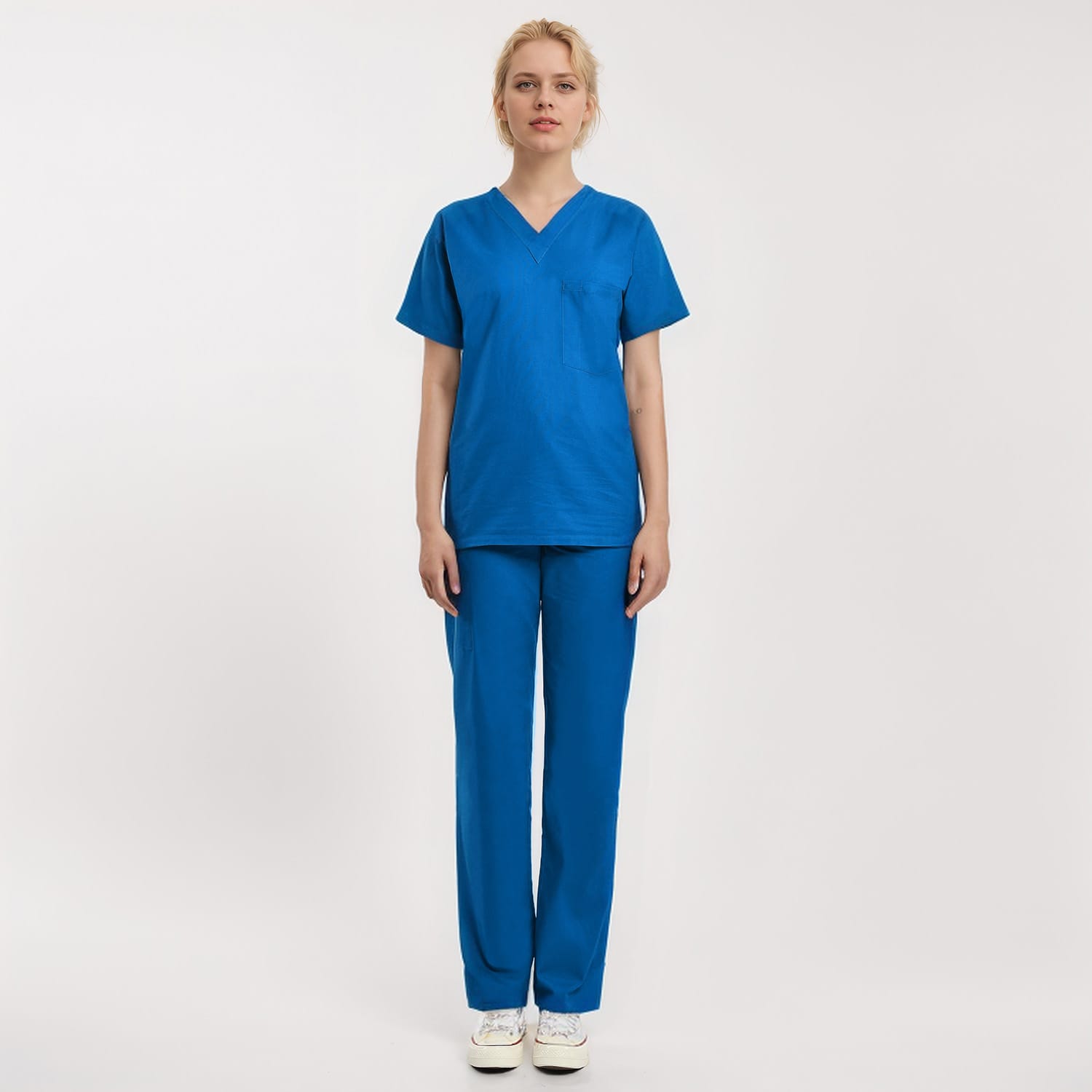 Front view of a model wearing a blue Scrub Unisex 1-Pocket V-Neck Scrub Top, designed for healthcare workers.