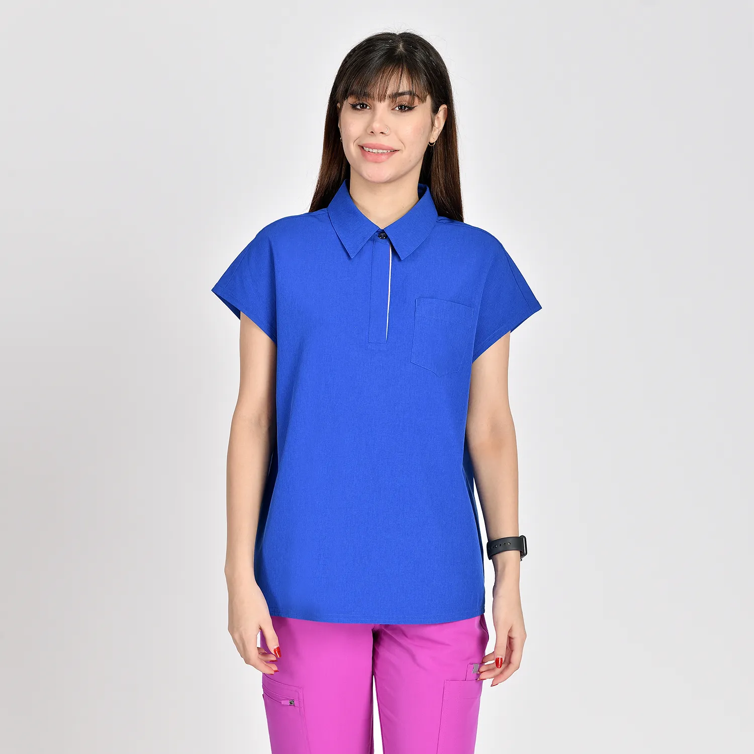 Women’s polo scrub top with a chest pocket, short sleeves, and a breathable fabric, ideal for healthcare workers in New York.