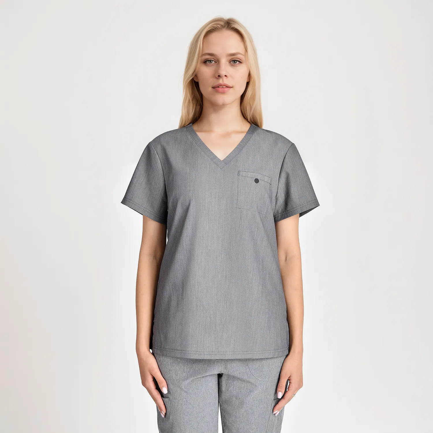Side view of a women's grey medical scrub top with chest pocket and V-neck, offering a comfortable and professional look for healthcare workers.