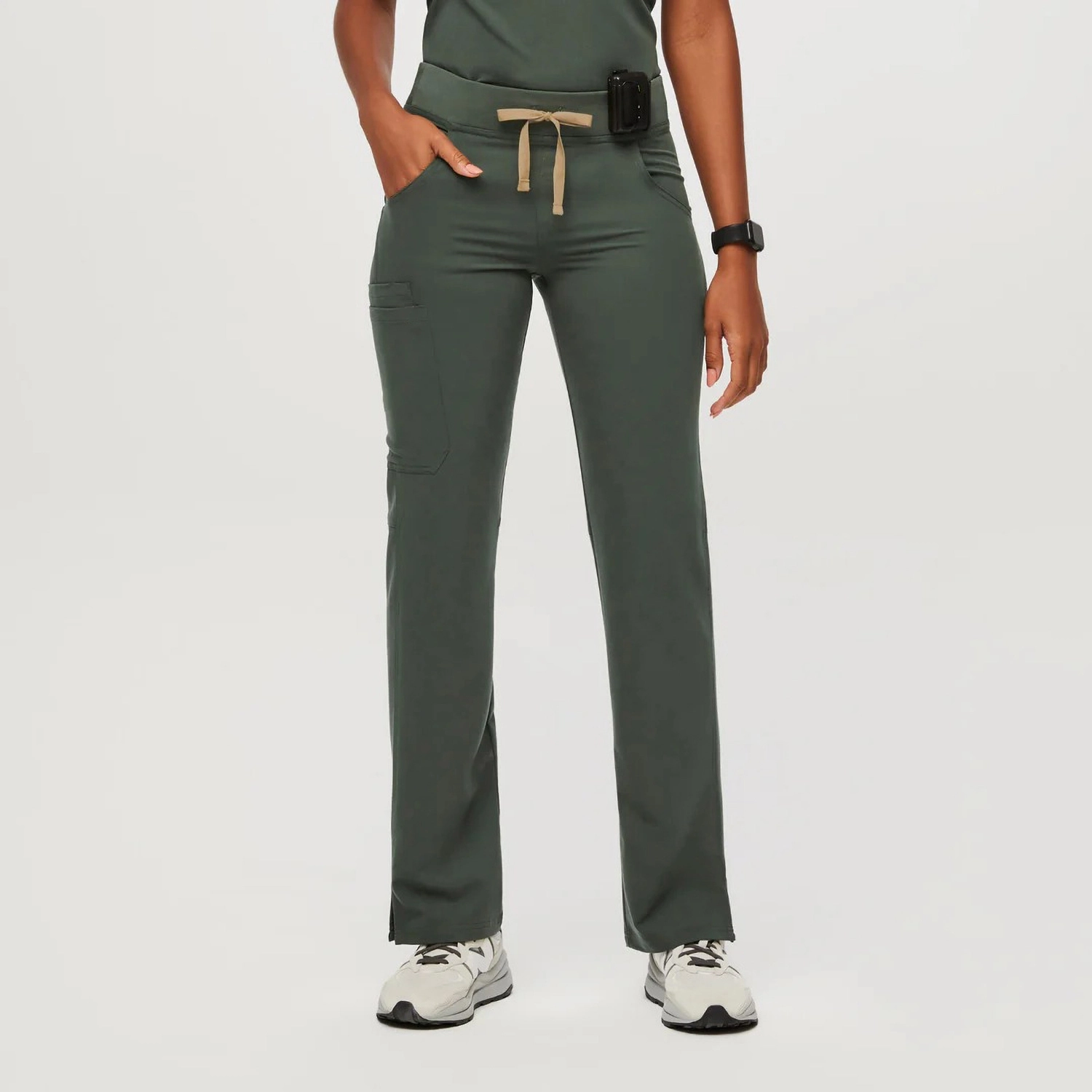 Women's olive medical scrub pants with a drawstring waist and multiple pockets for practicality in healthcare environments.