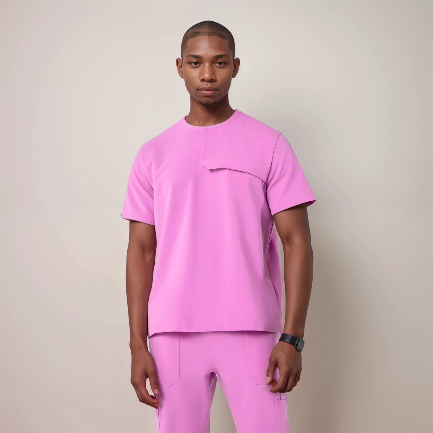 Front view of a men's pink scrub top with a v-neck and chest pocket, offering comfort and functionality for healthcare workers.