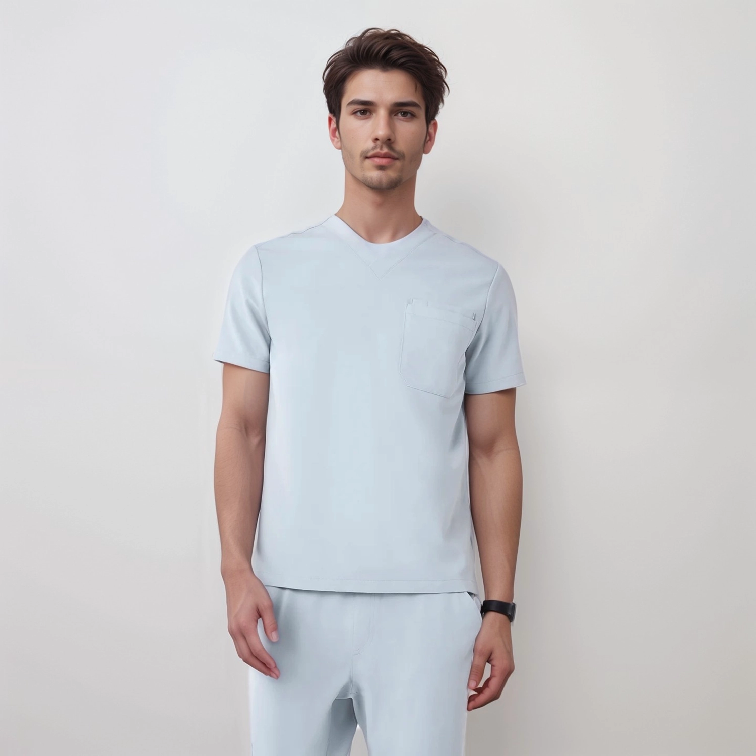 Close-up of a men's medical scrub top featuring a V-neck design and chest pocket, offering comfort and style for healthcare professionals.
